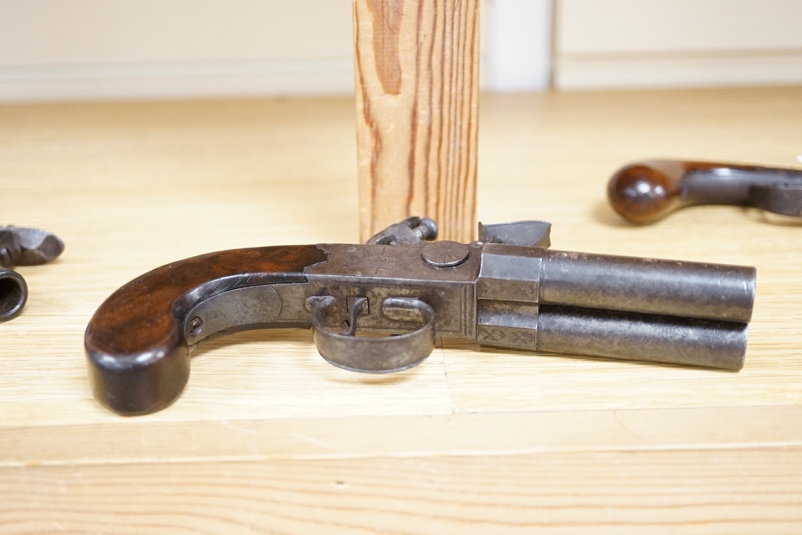 A double barrel flintlock, tap action pocket pistol by Collis of Oxford, with sliding top thumb safety, slab walnut grip, and tower private proof marks